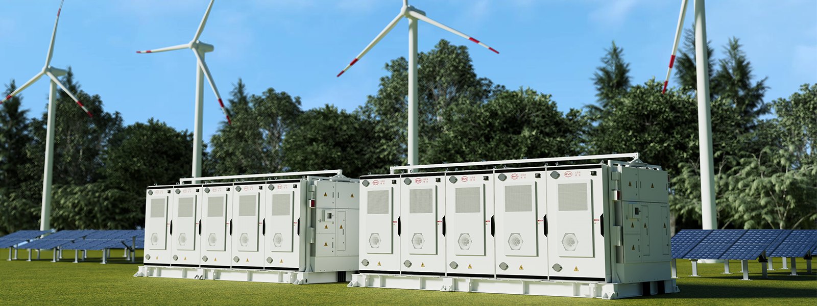 BYD MC Cube battery storage deployed in a field beside wind turbines and solar